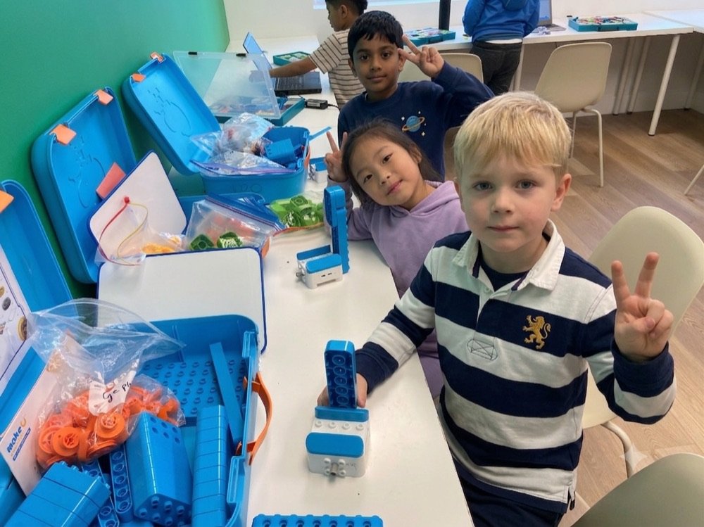 STEMA students building and coding